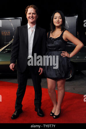 Actors Christopher Carley (L) and Ahney Her, cast members in director Clint Eastwood's new motion picture thriller 'Gran Torino' attend the film's world premiere on the Warner Bros. studio lot in Burbank, California on December 9, 2008.(UPI Photo/Jim Ruymen) Stock Photo