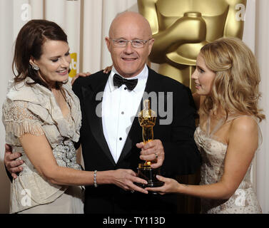 The family of actor Heath Ledger, (L to R) mother Sally Bell, father Kim Ledger and sister Kate Ledger, hold his Oscar for best supporting actor in the film 'The Dark Knight' at the 81st Academy Awards in Hollywood on February 22, 2009.   (UPI Photo/Phil McCarten) Stock Photo