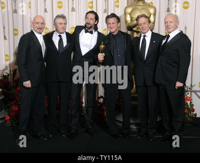 Adrien Brody holds his Oscar for Best Actor as he arrives for the ...