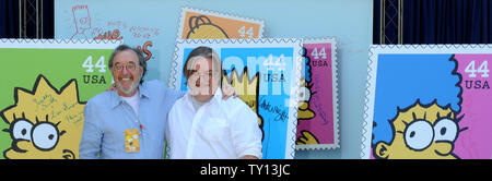 Creator and Executive Producer Matt Groening (R) and Executive Producer James L. Brooks pose for photographs at the unveiling of the new 'The Simpsons' U.S. postage stamps in Los Angeles May 7, 2009. (UPI Photo/Jim Ruymen) Stock Photo