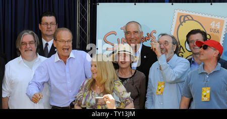 Actor Kelsey Grammer (2nd-L), the voice of Side Show Bob reacts as Creator and Executive Producer Matt Groening, Nancy Cartwright, the voice of Bart Simpson, Julie Kavner, the voice of Marge Simpson, Executive Producer James L. Brooks  and Dan Castellaneta, the voice of Homer Simpson (L-R) look on at the unveiling of the new 'The Simpsons' U.S. postage stamps in Los Angeles May 7, 2009. (UPI Photo/Jim Ruymen) Stock Photo