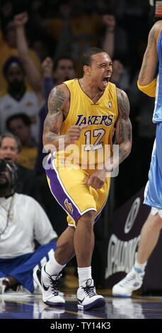 Los Angeles Lakers guard Shannon Brown reacts after he made a big dunk over Denver Nuggets Chris Anderson during the third quarter  of Game 5 of their Western Conference finals series at Staples Center in Los Angeles on May 27, 2009. The Lakers defeated the Nuggets'  103-94  to lead the best-of-seven series 3-2.  (UPI Photo/Lori Shepler) Stock Photo