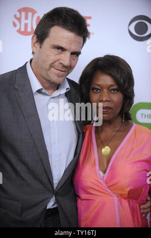 Alfre Woodard (R) and husband Roderick Spencer attend the CBS, CW, CBS Television Studios and Showtime Television Critics Association party in San Marino, California on August 3, 2009.      UPI/ Phil McCarten Stock Photo