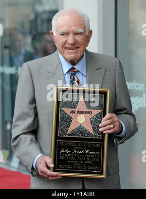 Judge Joseph A. Wapner, former host of the television series 'The People's Court', holds a replica plaque after Wapner received the 2,392nd star on the Hollywood Walk of Fame in Los Angeles on November 12, 2009. Wapner turns 90 years old November 15.     UPI/Jim Ruymen Stock Photo