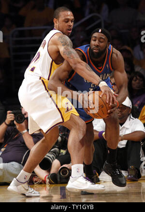 Los Angeles Lakers guard Shannon Brown (L) stops Oklahoma City Thunder guard James Harden  from passing the ball during the first half of Game 1 of their Western Conference playoff series at Staples Center in Los Ageles on April 18, 2010. The Lakers defeated the Thunder 87-79.   UPI Photo/Lori Shepler Stock Photo