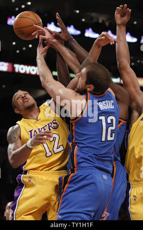 Los Angeles Lakers guard Shannon Brown (12) and Oklahoma City Thunder center Nenad Krstic (12) battle for the bal  during the first half of Game 2 of their Western Conference playoff series at Staples Center in Los Angeles on April 20, 2010. The Lakers defeated the Thunder 95-92. UPI Photo/Lori Shepler Stock Photo