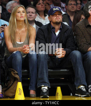 Leonardo DiCaprio with his girlfriend, Bar Refaeli watch the  Los Angeles Lakers play the Oklahoma City Thunder in Game 5 of their Western Conference playoff series at Staples Center in Los Angeles on April 27, 2010. The Lakers won 111-87. UPI Photo/Lori Shepler Stock Photo