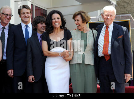 Actress Julia Louis-Dreyfus (4th-L) is flanked by  her husband Brad Hall (L) and their sons Henry (2nd-L) and Charlie and her mother Judy Bowles and stepfather L. Thompson Bowles during an unveiling ceremony honoring her with the 2,407th star on the Hollywood Walk of Fame in Los Angeles on May 4, 2010.     UPI/Jim Ruymen