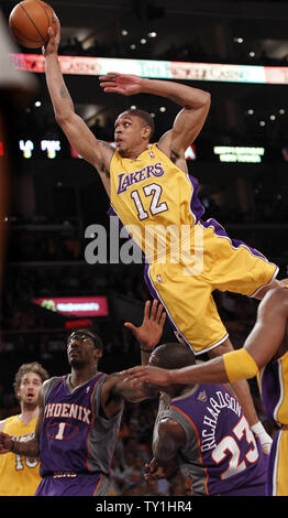 Los Angeles Lakers guard Shannon Brown makes a big dunk over Phoenix Suns forward Amare Stoudemire (1) and Jason Richardson  (23) during the second half of Game 1 of their Western Conference Finals series at Staples Center in Los Angeles on May 17, 2010. The Lakers won 128-107 . UPI Photo/Lori Shepler Stock Photo