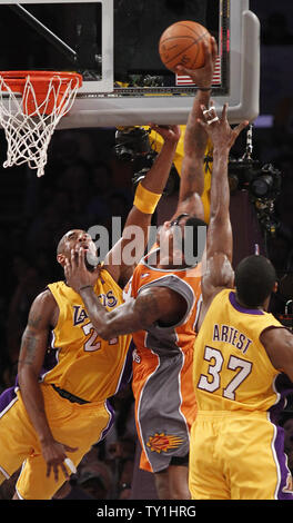 Los Angeles Lakers guard Kobe Bryant and Ron Artest, right, stop Phoenix Suns forward Amare Stoudemire from scoring  during the second half of Game 2 of their Western Conference Finals series at Staples Center in Los Angeles on May 19, 2010. The Lakers won 124-112 . UPI Photo/Lori Shepler Stock Photo