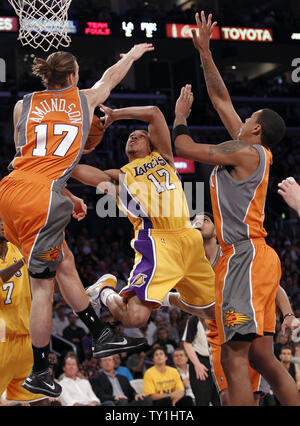 Los Angeles Lakers guard Shannon Brown (12) goes up for a basket over Phoenix Suns center Louis Amundson, left, and Channing Frye, right, during the first half of Game 2 of their Western Conference Finals series at Staples Center in Los Angeles on May 19, 2010. The Lakers won 124-112 . UPI Photo/Lori Shepler Stock Photo