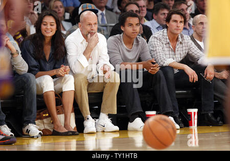 Bruce Willis, his wife Emma Heming, Connor Cruise with his dad, Tom Cruise watch the Los Angeles Lakers play the Phoenix Suns  during the first half of Game 2 of their Western Conference Finals series at Staples Center in Los Angeles on May 19, 2010. The Lakers won 124-112 . UPI Photo/Lori Shepler Stock Photo