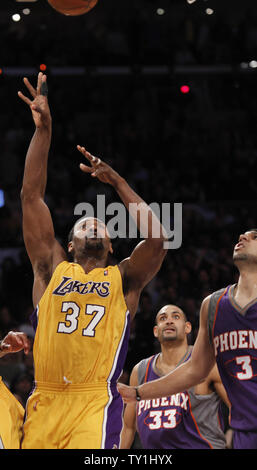 Los Angeles Lakers forward Ron Artest makes the game winning shot as Phoenix Suns forward Grant Hill (33) and Jared Dudley  (3) watch during the second half of Game 5 of their Western Conference Final series at Staples Center in Los Angeles on May 27, 2010. The Lakers defeated the Suns 103-101. UPI Photo/Lori Shepler Stock Photo