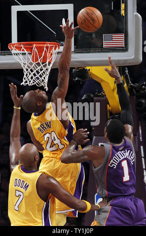 Los Angeles Lakers guard Kobe Bryant (24) blocks the shot of Phoenix Suns forward Amare Stoudemire (1) as Los Angeles Lakers forward Lamar Odom (7) watches  during the first half of Game 5 of their Western Conference Final series at Staples Center in Los Angeles on May 27, 2010. The Lakers defeated the Suns 103-101. UPI Photo/Lori Shepler Stock Photo