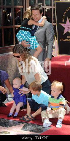 Actor Mark Wahlberg holds his daughter Ella as his wife Rhea Durham positions their children  Grace, Michael and Brendan look on during an unveiling ceremony on the Hollywood Walk of Fame in Los Angeles on July 29, 2010. Wahlberg was honored with the 2,414th star on the Walk of Fame.    UPI/Jim Ruymen Stock Photo