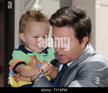 Actor Mark Wahlberg holds his son Brendan during an unveiling ceremony on the Hollywood Walk of Fame in Los Angeles on July 29, 2010. Wahlberg was honored with the 2,414th star on the Walk of Fame.    UPI/Jim Ruymen Stock Photo