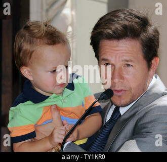 Actor Mark Wahlberg holds his son Brendan during an unveiling ceremony on the Hollywood Walk of Fame in Los Angeles on July 29, 2010. Wahlberg was honored with the 2,414th star on the Walk of Fame.    UPI/Jim Ruymen Stock Photo