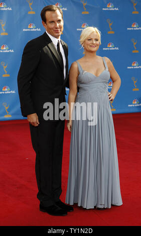 Amy Poehler and her husband Will Arnett appear backstage at the 60th