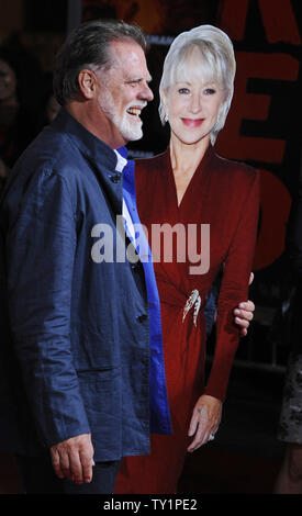 Director Taylor Hackford poses with a cardboard cutout of his wife, cast member Helen Mirren, who could not attend due to filming, during the premiere of the motion picture action comedy 'Red', at Grauman's Chinese Theatre in the Hollywood section of Los Angeles on October 11, 2010.   UPI/Jim Ruymen Stock Photo