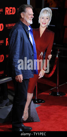 Director Taylor Hackford poses with a cardboard cutout of his wife, cast member Helen Mirren, who could not attend due to filming, during the premiere of the motion picture action comedy 'Red', at Grauman's Chinese Theatre in the Hollywood section of Los Angeles on October 11, 2010.   UPI/Jim Ruymen Stock Photo