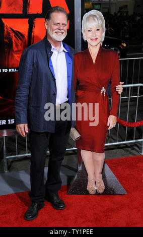 Director Taylor Hackford poses with a cardboard cutout of his wife, cast member Helen Mirren, who could not attend due to filming, during the premiere of the motion picture action comedy 'Red', at Grauman's Chinese Theatre in the Hollywood section of Los Angeles on October 11, 2010.   UPI/Jim Ruymen Stock Photo