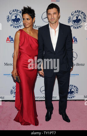 Actress Halle Berry and boyfriend Olivier Martinez arrive at the 32nd anniversary Carousel of Hope Ball in Beverly Hills, California on October 23, 2010. The ball benefits The Barbara Davis Center for Childhood Diabetes.   UPI/Jim Ruymen Stock Photo