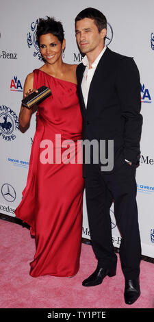 Actress Halle Berry and boyfriend Olivier Martinez arrive at the 32nd anniversary Carousel of Hope Ball in Beverly Hills, California on October 23, 2010. The ball benefits The Barbara Davis Center for Childhood Diabetes.   UPI/Jim Ruymen Stock Photo