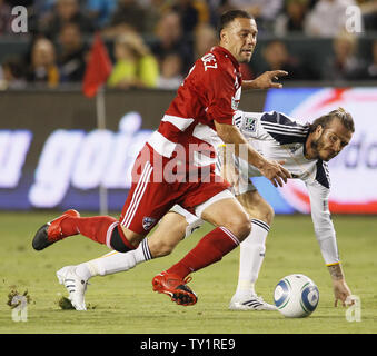 FC Dallas defender/midfielder Daniel Hernandez, left, and Los Angeles Galaxy midfielder David Beckham, right, battle for the ball in the Western Conference Fiinal playoff game at the Home Depot Center in Carson, California on Nov. 14, 2010.    UPI/Lori Shepler. Stock Photo