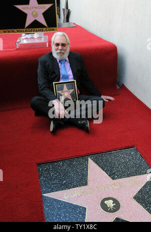 Canadian actor Donald Sutherland sits near his star during an unveiling ceremony honoring him with the 2,430th star on the Hollywood Walk of Fame in Los Angeles on January 26, 2011. Sutherland's star is set next to that of his son, actor Kiefer Sutherland.  UPI/Jim Ruymen Stock Photo