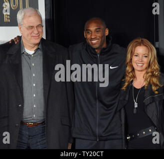 Los Angeles Lakers' Kobe Bryant poses with head coach Phil Jackson and Executive VP of Operations for the Los Angeles Lakers Jeanie Buss, following a hand & footprint ceremony at Grauman's Chinese Theatre in Los Angeles on February 19, 2011. Bryant became the first athlete to be immortalized at Grauman's. His hands and footprints will sit alongside Hollywood greats including John Wayne, Marilyn Monroe and super Laker fan, Jack Nicholson.  UPI/Jim Ruymen Stock Photo