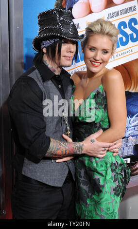 DJ Ashba (L) and Nicky Whelan attend the premiere of the motion picture comedy 'Hall Pass', at the ArcLight Cinerama Dome in Los Angeles on February 23, 2011.  UPI/Jim Ruymen Stock Photo