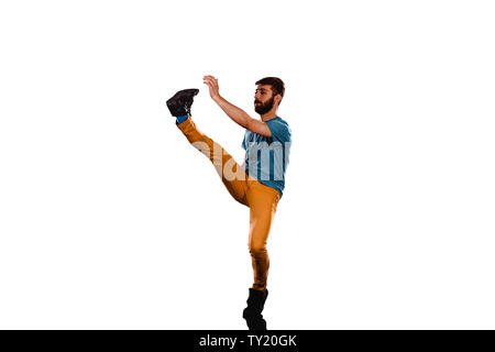 An urban guy is doing breakdance in the studio Stock Photo