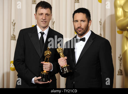 Achievement in Music (Original Score) winners Trent Reznor and Atticus Ross pose with their Oscars at the 83rd annual Academy Awards in Hollywood on February 27, 2011. UPI/Phil McCarten Stock Photo