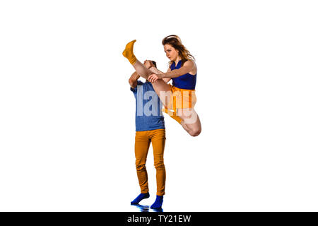 Teenagers skill and talent of modern dance, dancing in studio over white background Stock Photo