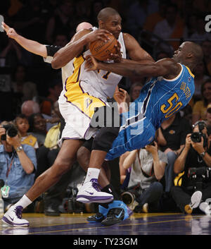 Los Angeles Lakers center Andrew Bynum (17) is fouled by New Orleans Hornets center Emeka Okafor (50)  during the first half of Game 1 of their Western Conference Playoff series at Staples Center in Los Angeles on April 17, 2011. The Hornets defeated the Lakers 109 to 100  . UPI Photo/Lori Shepler Stock Photo