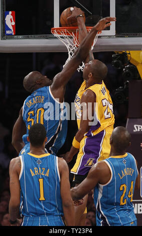 Los Angeles Lakers shooting guard Kobe Bryant (24) dunks over New Orleans Hornets center Emeka Okafor (50) during the first half of Game 5 of their Western Conference Playoff series at Staples Center in Los Angeles on April 26, 2011. The Lakers defeated the Hornets . UPI Photo/Lori Shepler Stock Photo