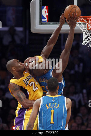 Los Angeles Lakers' Kobe Bryant (24) fouls New Orleans Hornets center Emeka Okafor (50) during the second half of Game 5 of their Western Conference Playoff series at Staples Center in Los Angeles on April 26, 2011. The Lakers defeated the Hornets 106 to 90 . UPI Photo/Lori Shepler Stock Photo