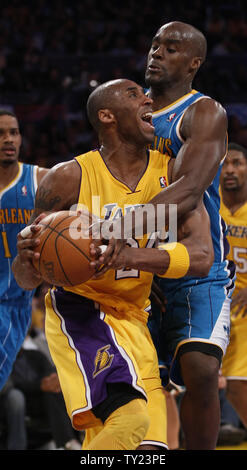 Los Angeles Lakers shooting guard Kobe Bryant (24) is fouled by New Orleans Hornets center Emeka Okafor (50) during the second half of Game 5 of their Western Conference Playoff series at Staples Center in Los Angeles on April 26, 2011. The Lakers defeated the Hornets 106 to 90 . UPI Photo/Lori Shepler Stock Photo