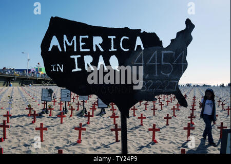 Thousands of war memorial crosses are on display at the Arlington West Memorial Project in Santa Monica, California on May 29, 2011. The beach memorial represents the 4,454 soldiers killed in Iraq and 2,393 killed in Afghanistan. The 12 mock caskets (not pictured) represent the soldiers killed this week: 10 in Afghanistan and 2 in Iraq.    UPI /Jim Ruymen) Stock Photo