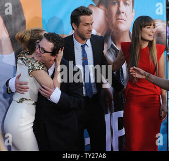 Director David Dobkins hugs cast member Leslie Mann as cast members Ryan Reynolds and Olivia Wilde look on during the premiere of the motion picture comedy 'The Change-Up', at the Village Theatre in Los Angeles on August 1, 2011.   UPI/Jim Ruymen Stock Photo