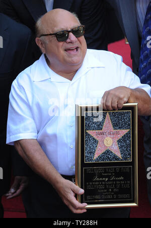 Actor Danny DeVito, holds a replica plaque after he was honored with the 2,445th star on the Hollywood Walk of Fame during an unveiling ceremony in Los Angeles on August 18, 2011.  UPI/Jim Ruymen Stock Photo