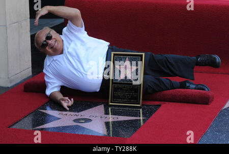 Actor Danny DeVito, holds a replica plaque after he was honored with the 2,445th star on the Hollywood Walk of Fame during an unveiling ceremony in Los Angeles on August 18, 2011.  UPI/Jim Ruymen Stock Photo