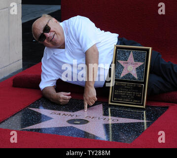 Actor Danny DeVito, holds a replica plaque after he was honored with the 2,445th star on the Hollywood Walk of Fame during an unveiling ceremony in Los Angeles on August 18, 2011.  UPI/Jim Ruymen Stock Photo