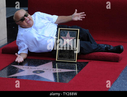 Actor Danny DeVito, holds a replica plaque after he was honored with the 2,445th star on the Hollywood Walk of Fame during an unveiling ceremony in Los Angeles on August 18, 2011.  UPI/Jim Ruymen Stock Photo