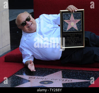 Actor Danny DeVito, holds a replica plaque after he was honored with the 2,445th star on the Hollywood Walk of Fame during an unveiling ceremony in Los Angeles on August 18, 2011.  UPI/Jim Ruymen Stock Photo