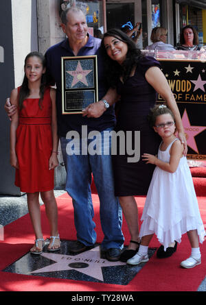 Actor Ed O'Neill poses with his wife Catherine Rusoff and their daughters during an unveiling ceremony honoring him with the 2,446th star on the Hollywood Walk of Fame in Los Angeles on August 30, 2011. UPI/Jim Ruymen Stock Photo