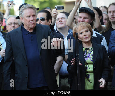 The late Buddy Holly received a posthumous star on Hollywood's Walk of Fame on his 75th birthday on Vine Street in front of The Capitol Records Building in Los Angeles on September 7, 2011.  Gary Busey and Maria Elena Holly wait for their turn to speak at the event.  UPI/Jayne Kamin-Oncea Stock Photo