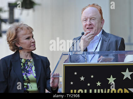 The late Buddy Holly received a posthumous star on Hollywood's Walk of Fame on his 75th birthday on Vine Street in front of The Capitol Records Building in Los Angeles on September 7, 2011. His widow, Maria Elena Holly who made a rare appearance at the event, listens as record producer Peter Asher says a few words.   UPI/Jayne Kamin-Oncea Stock Photo