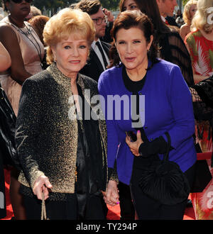 Singer Debbie Reynolds (L) and her daughter, actress Carrie Fisher arrive for the Primetime Creative Arts Emmy Awards at the Nokia Theatre in Los Angeles on September 10, 2011.  UPI/Jim Ruymen Stock Photo
