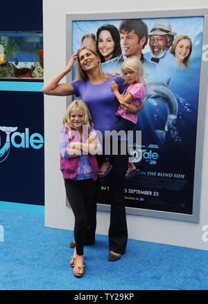 Volleyball star turned model Gabrielle Reece and her daughters Reece (L ...